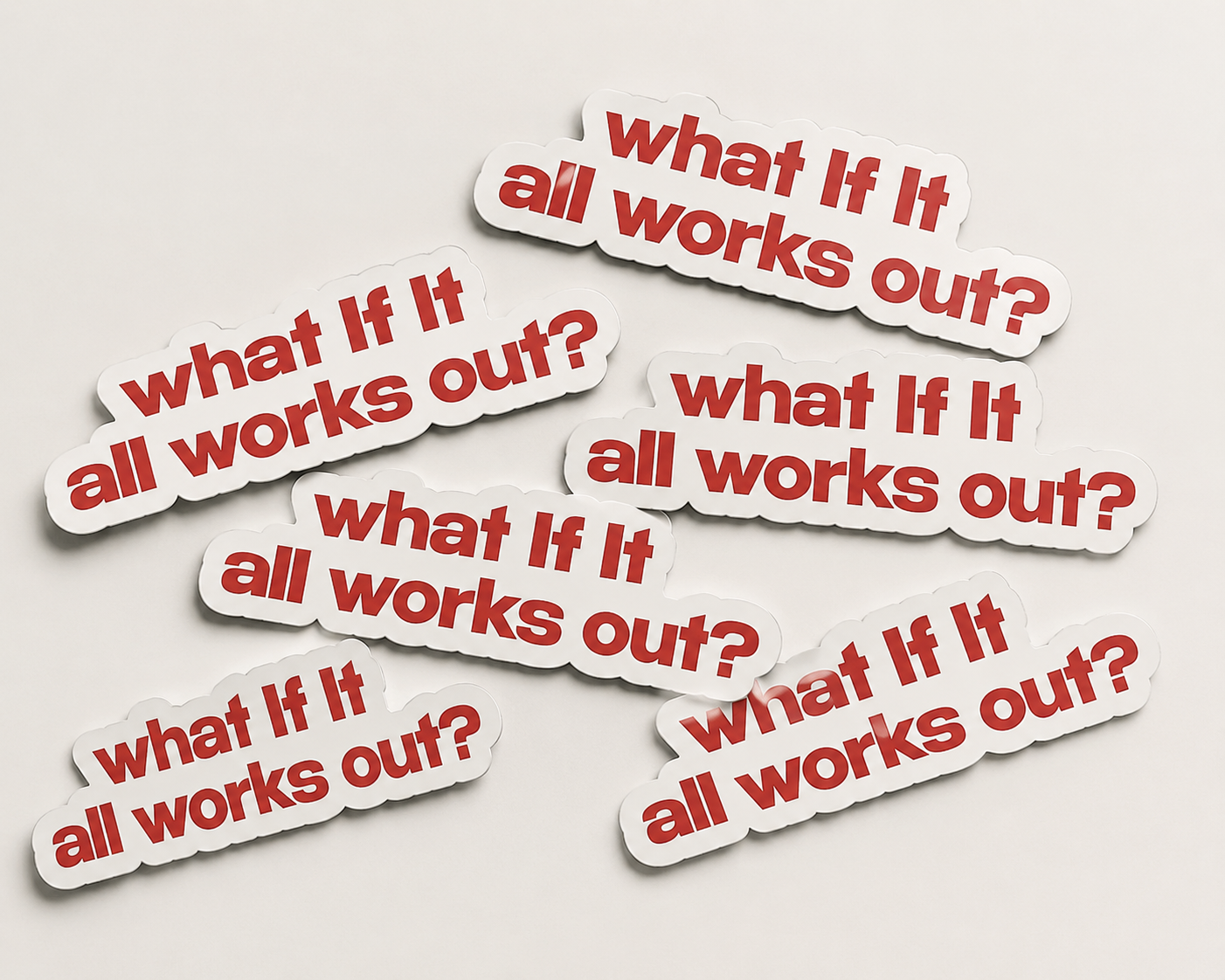 Multiple stickers with the text 'what If It all works out?' on a light gray background